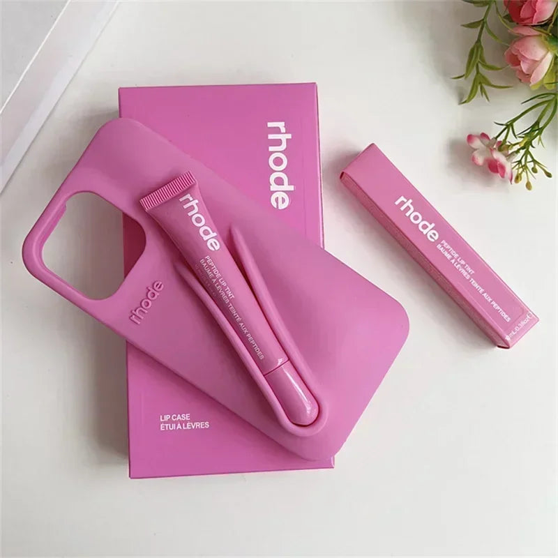 Pink Rhode lip care product with 'rhode' branding on a white background