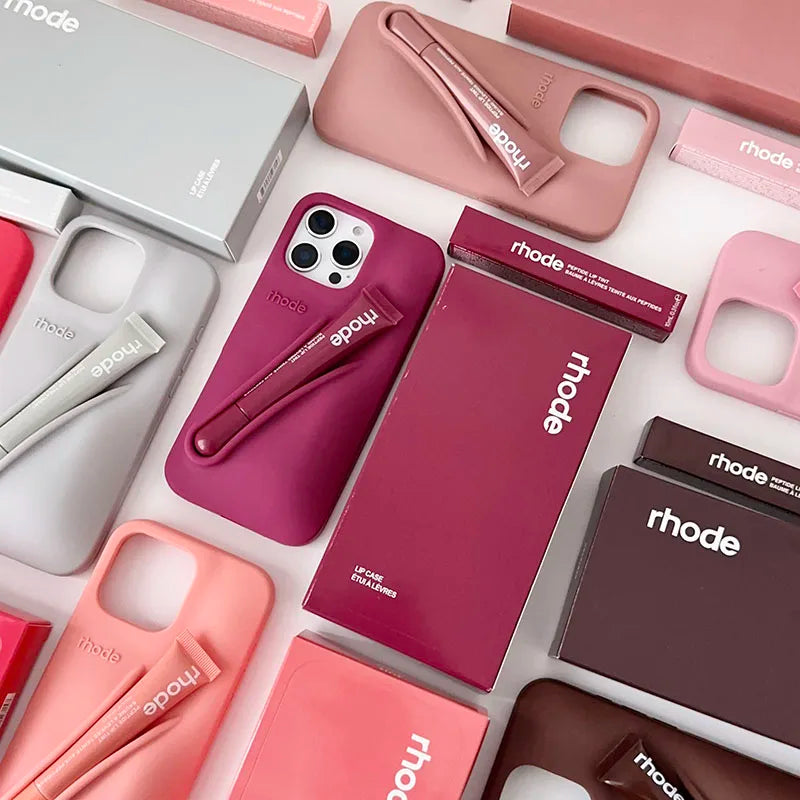 Collection of phone cases and accessories with 'rhode' branding on a white background