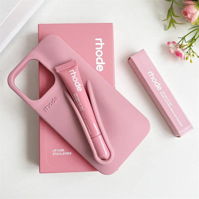 Pink lip care products with 'rhode' branding on a white background